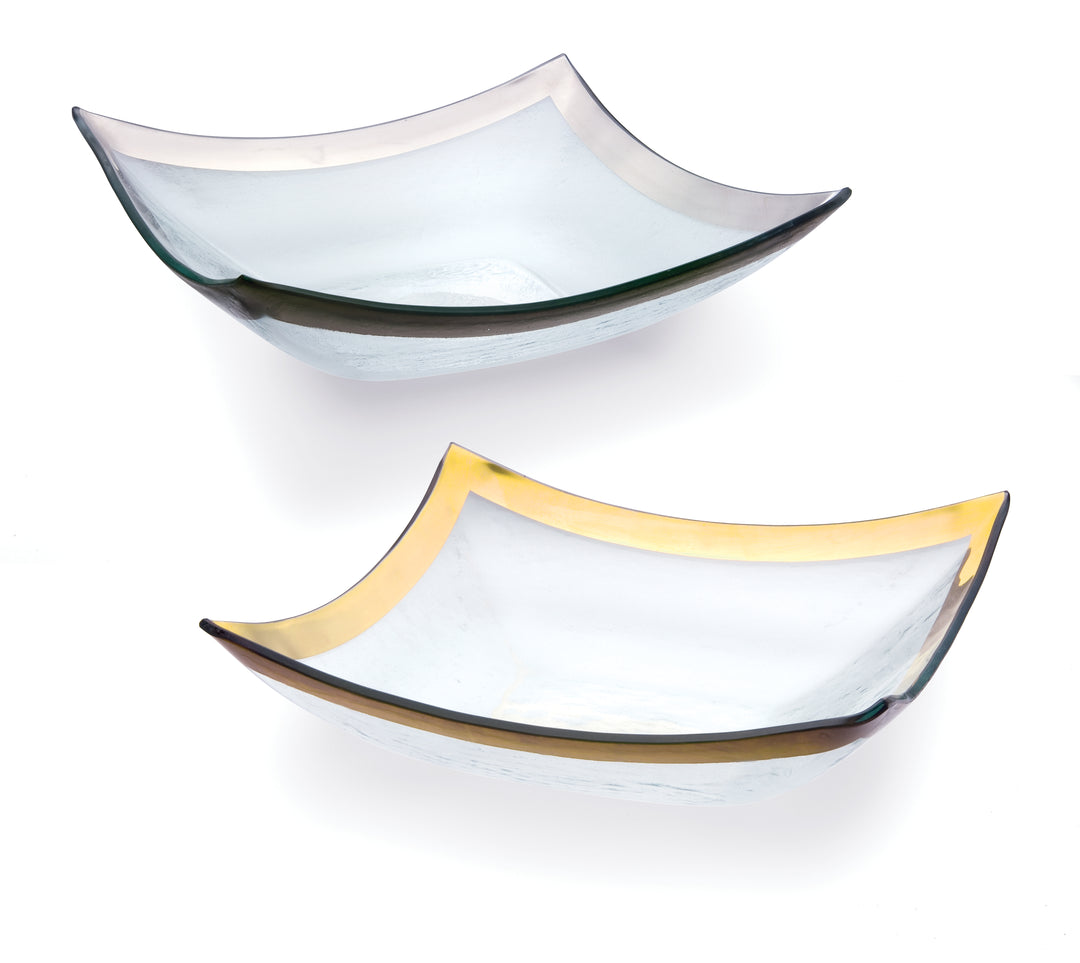 Two four point bowls on clear glass with a 24k gold and platinum bands.