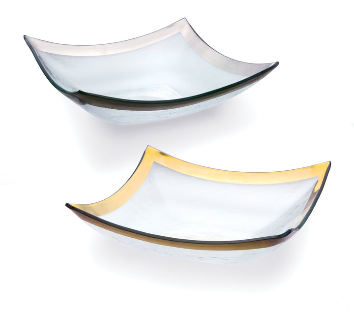 Two four point bowls on clear glass with a 24k gold and platinum bands.