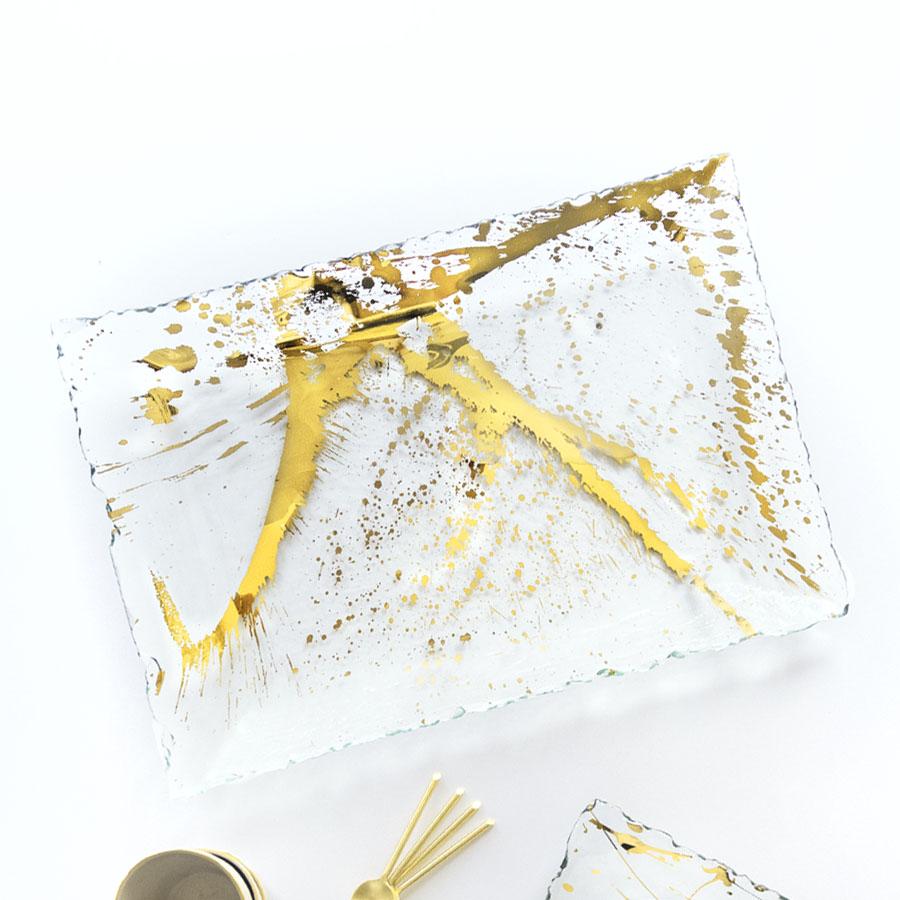 Jaxson rectangular tray with 24k gold splatter on top.