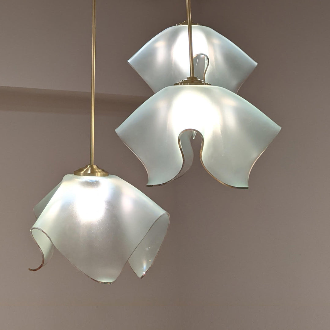 Triple tulip chandelier set made from frosted glass and a 24k gold trim.