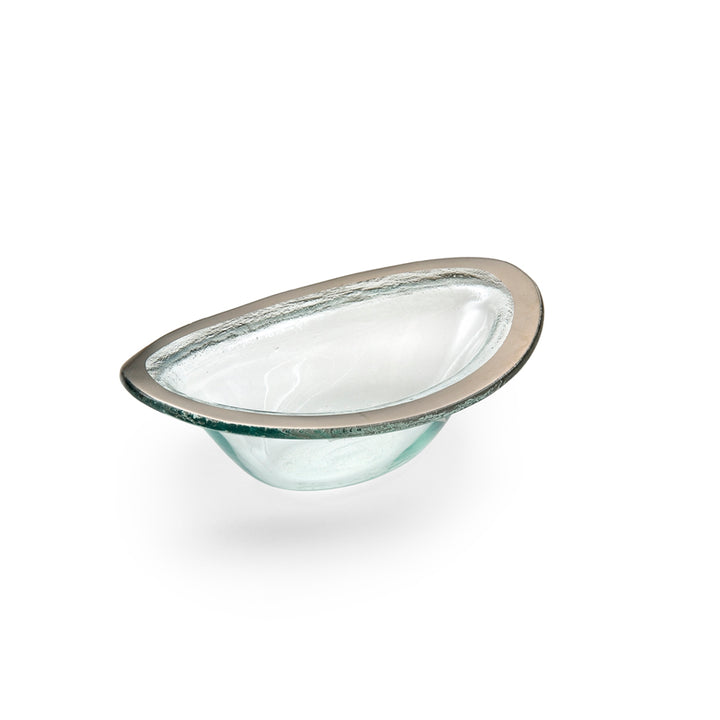 Small sauce bowl on clear glass and a platinum band.