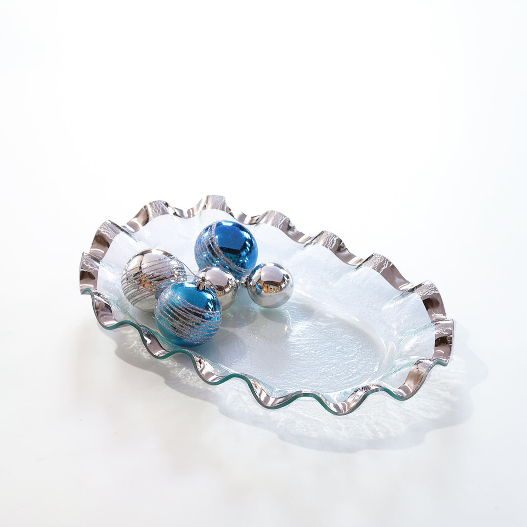 Ruffle large shallow oval bowl with a platinum rim and ornaments.