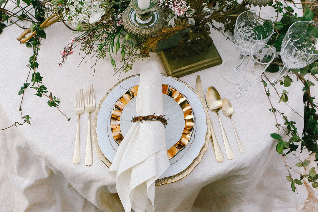 Wedding table setting feature Annieglass Ruffle Salad plate with vintage china