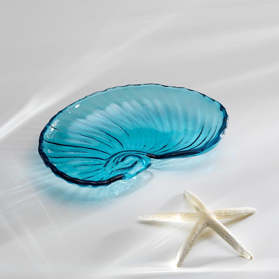 Ultramarine medium size nautilus shell shaped with ridges and a star to the side.