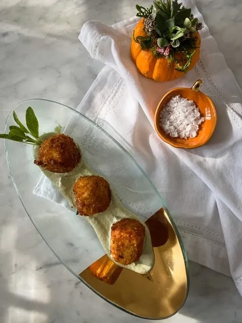 Butternut squash risotto balls served on Annieglass mod oval server.