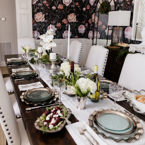 Classic winter holiday tablescape with platinum & gold buffet plates, dinner plates