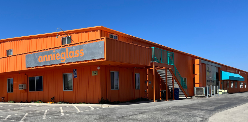Orange building with metal Annieglass sign.