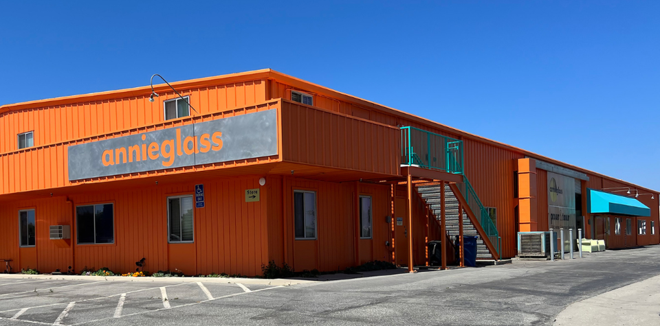 Orange building with metal Annieglass sign.