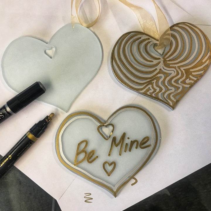 Heart shape ornaments decorated with metallic marker pens