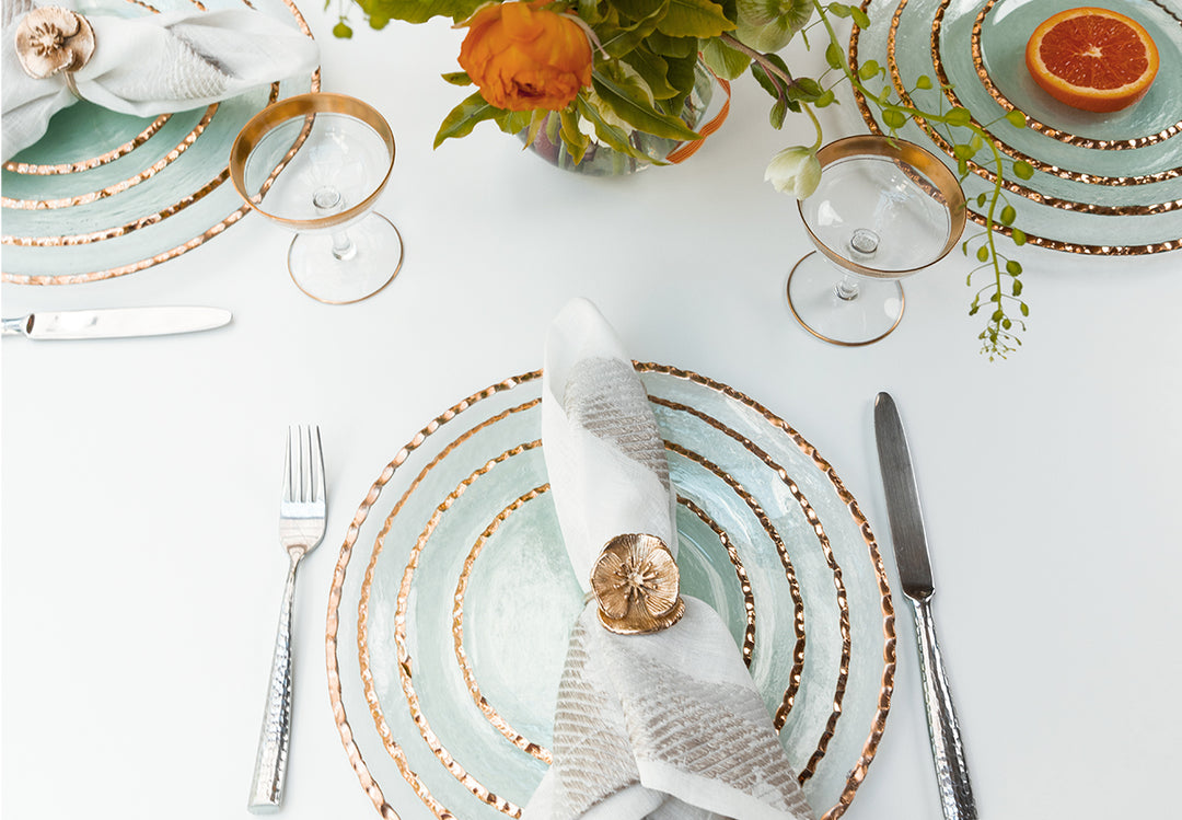 Edgey table setting wtih salad bowl, small plate, dinner plate and charger