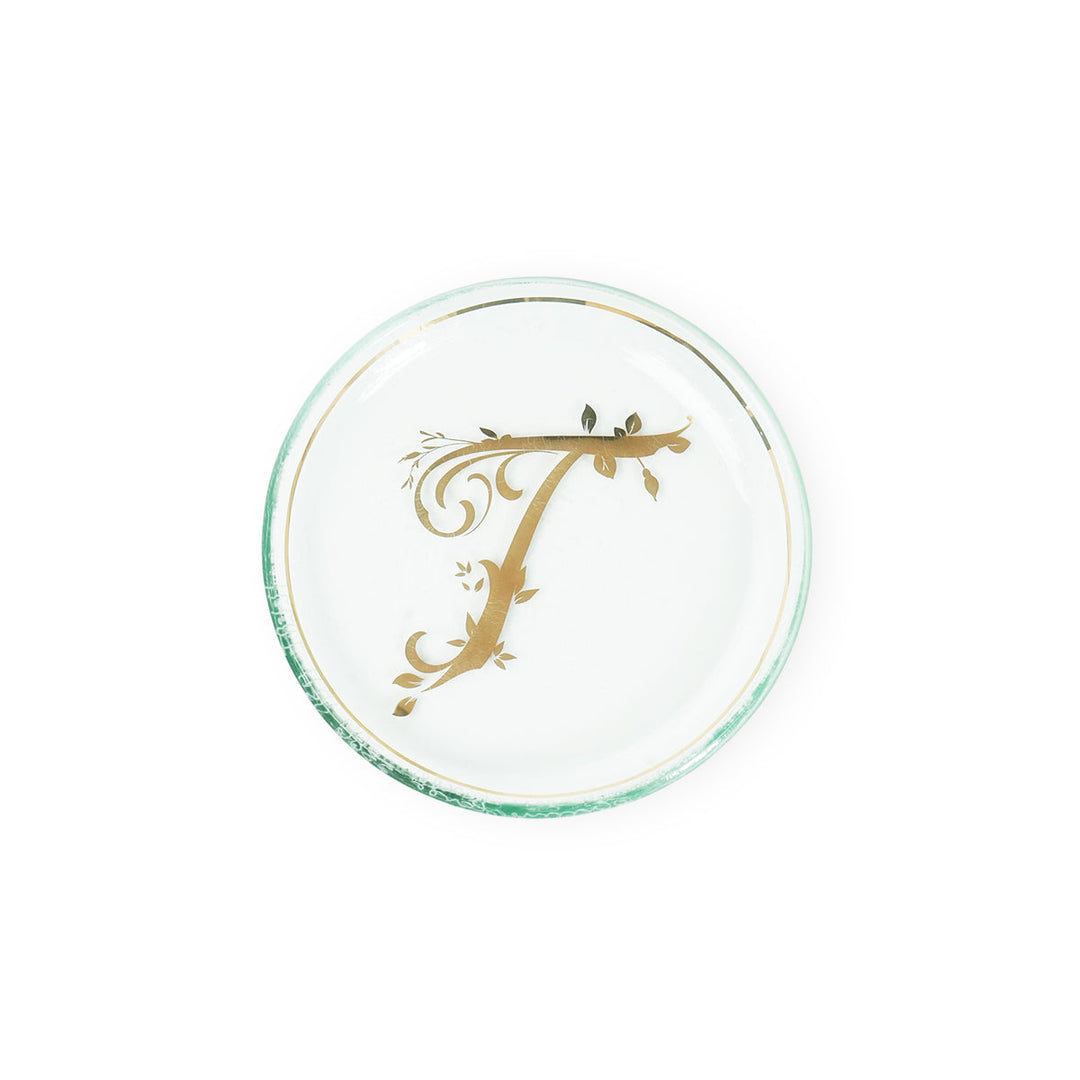 Mini plate with a 24k gold rim & a letter T in the center.