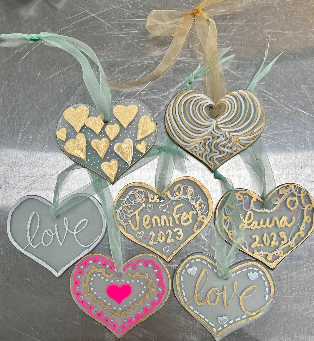 heart shape glass ornaments decorated with metallic marker pen
