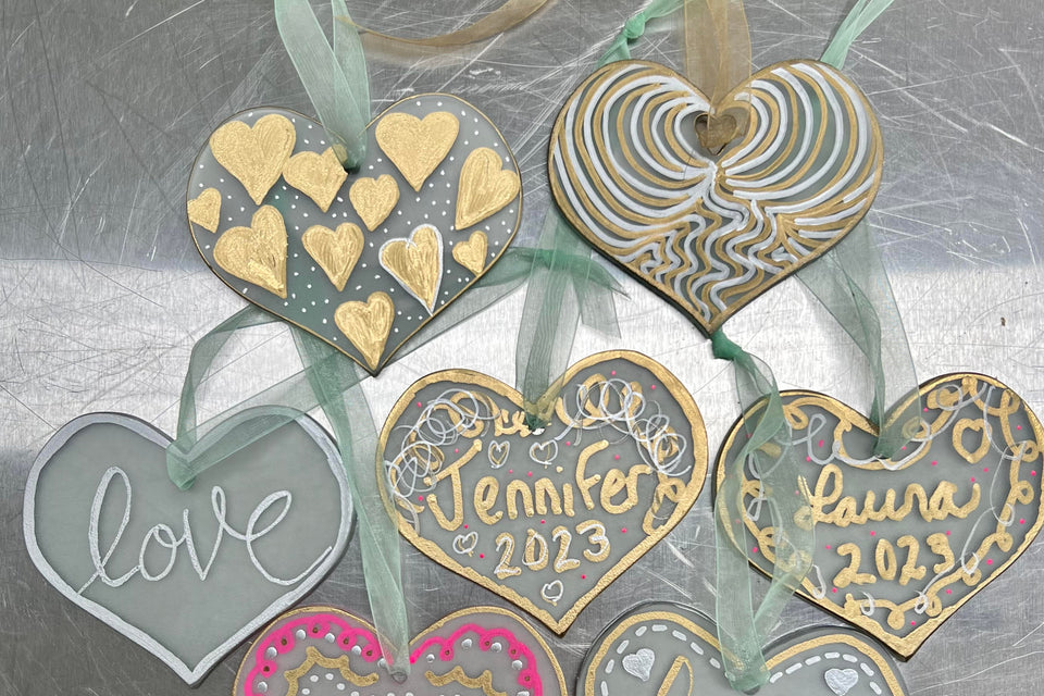 heart shape glass ornaments decorated with metallic marker pen