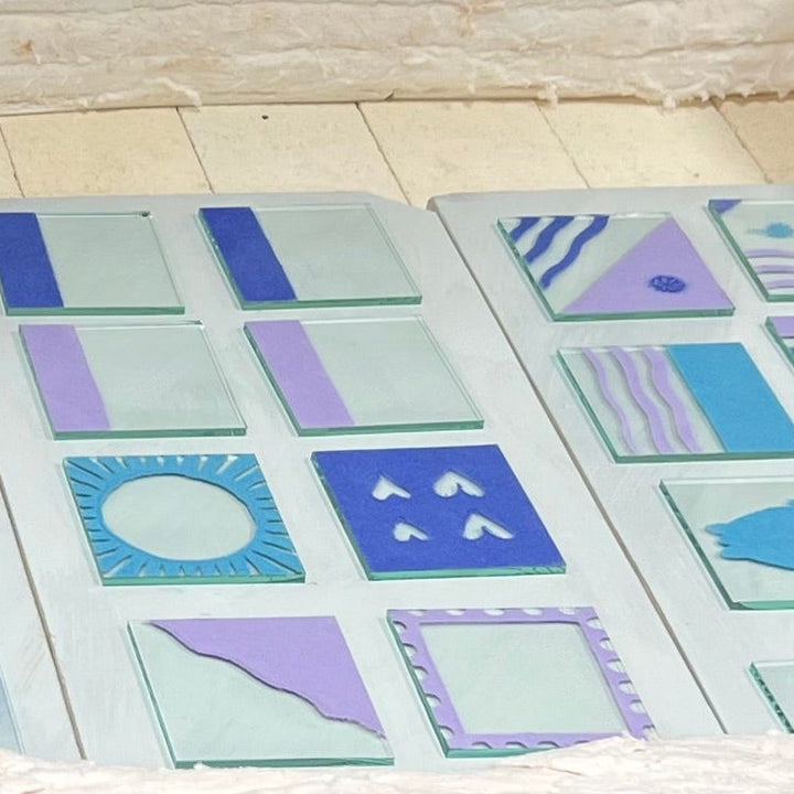 Glass coasters with geometric patterns inside a kiln