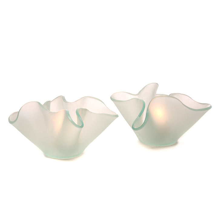 This frosted glass votive celebrates the beauty of slumped glass with free form folds.